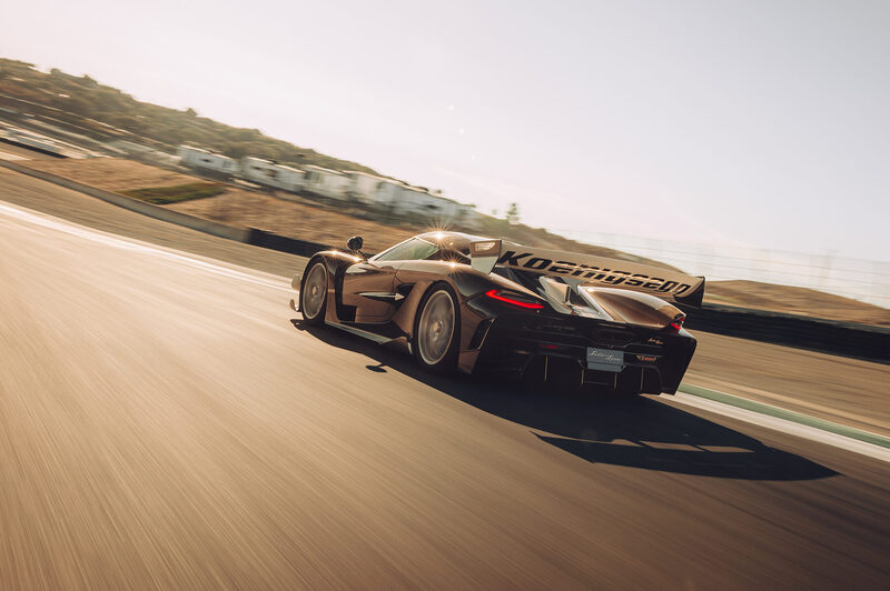 Koenigsegg Sadair’s Spear at speed on the Laguna Seca circuit, rear three-quarter