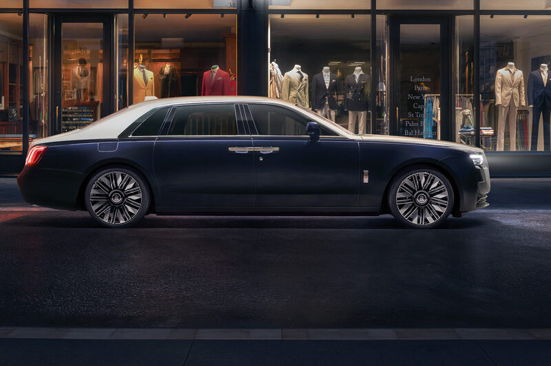 Rolls-Royce Ghost Extended in profile at dusk before the lit tailor shopfronts of Savile Row